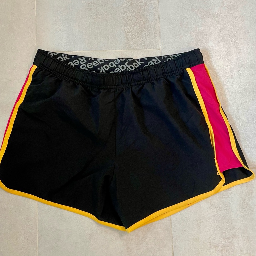 Reebok Women's Black Shorts with Pink and Orange Accents
